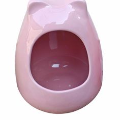 a pink cat toilet bowl with the lid open and water in it's mouth