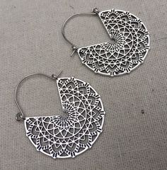 "These are so chic and cool! Stylish and versatile mandala hoop earrings. They have incredible detail and design with all the cut outs. Versatile and perfect for everyday wear. The earrings measure 1 3/4\" long by 1 3/8\" wide. Made from allergy free plated silver. Thanks for stopping by! Please take a moment and visit the rest of my Etsy shop. I have many more unique jewelry designs to choose from! 🌸 Tiger Flower Jewelry 🌸 🌸 Inspired by Nature 🌸" Modern Hoop Earrings, Mandala Earrings, Boho Hoop Earrings, Hoop Earrings Silver, Hammered Hoop Earrings, Unusual Earrings, Big Hoop Earrings, Earrings Bohemian, Unique Jewelry Designs