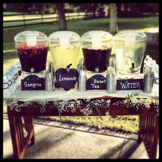 a table topped with cups filled with liquid