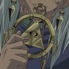 an anime character holding a steering wheel in front of his face