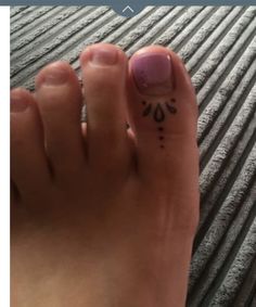 a person's foot with the word love written on it