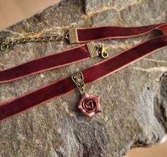 "Velvet ribbon choker with sculpted flower. Material of rose is polymer clay. Each petal of flower made by hand Dia flower about 15 mm/ 0.55 \" Length of necklace is adjustable: 10-12 inches/ 25,4 - 30,5 cm 11-13 inches/ 28-33 cm 12-14 inches/ 30.5- 35.5 cm 13-15 inches/ 33-38 cm 14-16 inches/ 35.5 cm-40.5 cm 15-17 inches/ 38,1 cm- 43,2 cm 16-18 inches/ 40.6 cm- 45.7 cm 17-19 inches/ 43 cm - 48 cm 18-20 inches/ 45,5- 50.8 cm Width of ribbon 10 mm / 0.4 inch Polymer clay isn't afraid of water, st Adjustable Choker Necklace With Ribbon, Adjustable Ribbon Choker Necklace, Rose Design Choker Necklace, Adjustable Rose Gold Choker, Adjustable Rose Choker Necklace, Handmade Adjustable Choker For Valentine's Day, Valentine's Day Adjustable Handmade Choker, Adjustable Rose Design Choker Necklace, Adjustable Rose Gold Necklaces With Rose Design