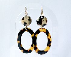 This earring is simplicity at its best. I took a circular disc of acetate with beveled edges -these pieces were made by my family in the mid-90s as a custom order for another design house, and linked them to recently made tortoise shell oval link.  I buffed and polished them up and linked a gold-filled earwire through the opening, and it made this very chic, timeless & classic earring.  I was only able to make three of these, very limited run. All of our jewelry is made from the finest Italian acetate-a light-weight vegan plastic. Please remember when purchasing our jewelry that Acetate is material that will not break or chip easily like other plastics and horn jewelry out on the market. This is a plastic made for the optical industry, so it was created for durability and comfort. All of o Resin Earring, Mid 90s, Horn Jewelry, Classic Earrings, Statement Earring, Beautiful Gift Wrapping, Cellulose Acetate, Filigree Design, Gold Pattern