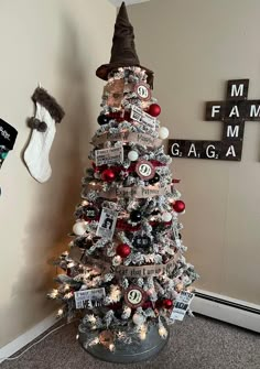 a decorated christmas tree in the corner of a room