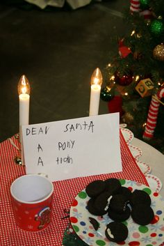 a table topped with cookies and a sign that says dear santa, a poky