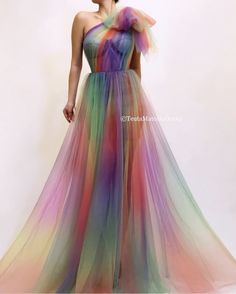 Details  - Rainbow color  - Tulle fabric  - One-shoulder dress shape with waist definition  - For special occasions Rainbow Wedding Dress, Teuta Matoshi, Rainbow Wedding, Diy Vetement, Rainbow Outfit, Rainbow Fashion, Rainbow Dress, Dress Shapes, Beautiful Gowns