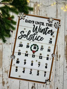 a wooden sign with the words days until the winter solstice