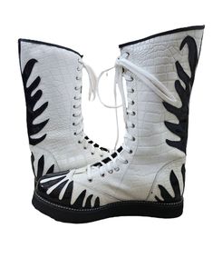 Step into the ring with confidence and style wearing our Handmade  Leather Wrestling Boots. Crafted with 100% genuine leather, these boots boast not only unparalleled durability but also a unique and luxurious aesthetic. The striking White Crocodile Leather Pattern  with Black Fire style, Black sole AND Black  laces adding an extra dimension to your wrestling attire.  White Crocs Leather with Black fire make it's look beautiful and unique.  these are High Quality A Leather made.  you also have a White Leather Moto Boots For Streetwear, Wrestling Boots, White Crocs, Black Fire, Crocodile Leather, Leather Pattern, Black Laces, Short Boots, Pro Wrestling