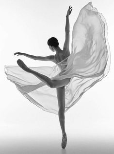 a black and white photo of a ballerina