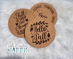 three cork coasters that say hello fall, leaves pumpkins and love is in the air