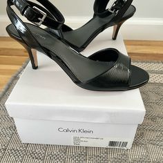 New Calvin Klein Black Laila Open Toe Sandal With Ankle Strap And 2.5 In Heel. Never Worn. Black Ankle-high Sandals With Padded Heel, Medium Width Patent Leather Sandals With Pointed Toe, Calvin Klein Chic Ankle Strap Heels, Chic Calvin Klein Open Heel Sandals, Chic Calvin Klein Ankle Strap Heels, Ankle Strap Patent Leather Sandals Of Medium Width, Patent Leather Ankle Strap Sandals Medium Width, Medium Width Ankle Strap Patent Leather Sandals, Medium Width Patent Leather Sandals With Ankle Strap