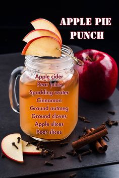 apple cider punch recipe in a mason jar with cinnamon, apples and spices around it