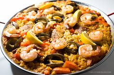 a paella with shrimp, mussels and olives