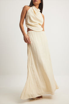 Crinkle Open Back Halterneck Top & Structured Maxi Skirt Flowy Asymmetrical Beige Maxi Skirt, Chic Maxi Dress With Relaxed Lined Skirt, Beige Flowy Asymmetrical Maxi Skirt, Beige Asymmetrical Flowy Maxi Skirt, Chic Relaxed Fit Maxi Skirt, Chic Maxi Dress With Flowy Asymmetrical Skirt, Chic Flowy Maxi Dress With Lined Skirt, Chic Maxi Dress With Voluminous Lined Skirt, Cream Relaxed Maxi Skirt For Spring