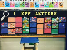 a classroom bulletin board with pictures on it and the words i spy letters written below