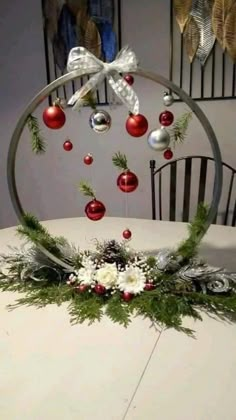 a table topped with ornaments and greenery