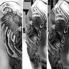 the back of a man's arm with an eagle tattoo on it