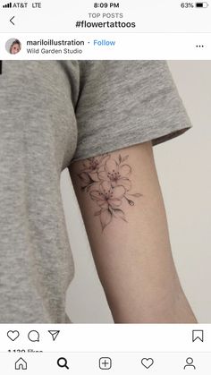 a person with a flower tattoo on their arm