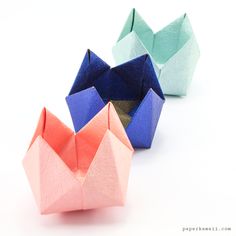 three origami boats sitting next to each other