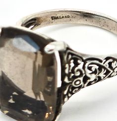 Smokey Quartz large CNA vintage open work filigree sterling silver ring. Good used condition with little to no signs of normal wear. Great vintage patina. Stamped on the inside of the band CNA 925 Thailand. Acid tests positive for sterling silver. Gemstone tested with Presidium II gemstone tester. Ring measures size 7. Vintage Silver Filigree Ring, Carved Vintage Filigree Ring Gift, Vintage Carved Filigree Ring Gift, Vintage Sterling Silver Filigree Ring, Vintage Sterling Silver Filigree Ring Collectible, Vintage Filigree Ring Stamped 925 As Gift, Vintage Silver Filigree Ring With Carved Details, Vintage Silver Carved Filigree Ring, Vintage Silver Filigree Ring Hallmarked