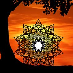 the silhouette of a tree against an orange sky with a circular design on it's face