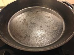 an old frying pan sitting on top of a stove with no burners or cooking utensils