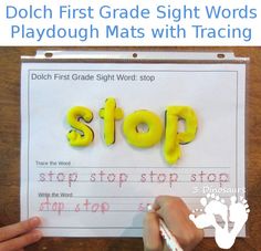 a hand holding a piece of paper that says dolch first grade sight words playdou mats with racing