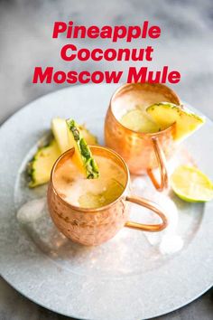 two glasses of pineapple coconut moscow mules on a white plate with the title above it