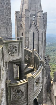 an old building with a spiral staircase going up it's side to the sky