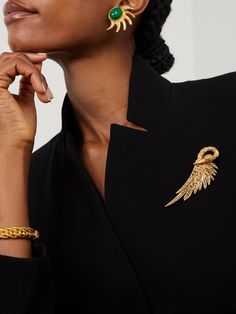 Sonia Petroff's jewelry is inspired by the founder's original handmade, mid-century designs. Cast from gold-plated metal, this brooch is shaped to resemble a swan and set with scores of tonal Swarovski crystals that sparkle from every angle. Pin it to the lapel of your blazer. Elegant Yellow Gold Brooches For Party, Elegant Yellow Gold Party Brooches, Chic Gold Brooch For Evening, Luxury Gold Brooch Lapel Pin, Gold Wedding Brooches In Chic Style, Chic Gold Wedding Brooch, Gold Wedding Brooches Chic Style, Chic Gold Wedding Brooches, Gold Chic Wedding Brooches