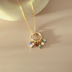 "A Mother's Birthstones Necklace features a ring-shaped clasp adorned with many birthstones embodies the children in a mother's life, symbolizing the connection between she and her children. Meticulously handcrafted for lasting beauty, this birthstone necklace is a special and heartfelt gift, making it a treasured keepsake Mom will cherish forever. P R O D U C T ∙ I N F O * Material: Solid 925 Sterling Silver  * Finishing: Silver - Yellow Gold - Rose Gold  * Necklace length: You can choose up to Children Birthstone Jewelry Mom, Round Charm Birthstone Necklace For Birthday Gifts, Charm Birthstone Necklace For Birthday Gift, Round Charms Birthstone Necklace Birthday Gift, Round Birthstone Necklace With Charms For Birthday, Gift Multi-stone Birthstone Pendant Necklace, Multi-stone Birthstone Pendant Necklace Gift, Birthday Round Gemstone Charm Necklace, Mother's Day Round Birthstone Necklace With Charms