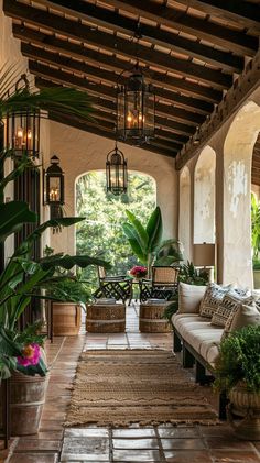 an outdoor living room with lots of plants