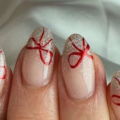 Carys barnes on Instagram: "🎀 help me tie a bow   Shona let me decide today what was putting on so thought these was very pretty to recreate. They was inspired by @nailsbyheather.errington   Products used:  @nailstampingqueenuk  red chrome  @dali.artistic  white glitter gel polish   #nails #christmasnails #bownails #festivenails #nailsofinstagram #nailsonfleek" Red With White Chrome Nails, Glitter Bow Nails, Christmas Bow Nail Designs, Red Chrome Nails With Bow, Christmas Nails Sparkly Red, White Glitter Gel Polish, Red Bow Nails, Gel Polish Nails, Bow Nail Designs