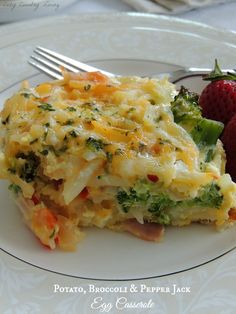 a close up of a plate of food with broccoli and cheese on it