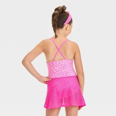 Dress up your fashionista for the beach or pool with the Leopard-Spot-Printed One-Piece Swimsuit Set from Cat & Jack™. This two-piece swimwear set includes a one-piece swimsuit with full lining and a crochet cover-up sarong with a side tie for a charming look. The swimsuit is covered with a pink leopard print and features crisscross straps on the back. Tailored from recycled polyester and stretchy spandex, this swimsuit set offers comfort all the time, whether they're diving, playing in the sand Fitted Summer Playwear Tankini, Stretch Tankini For Beach Playwear, Spring Playful Tankini For Swimming, Playful Fitted Tankini For Vacation, Fitted Tankini With Built-in Bra For Summer, Spring Beachwear Swimwear For Play, Summer Beachwear Tankini For Playwear, Playful Fitted Spring Tankini, Playful Sleeveless Tankini For Beach Season