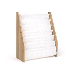 a wooden magazine rack with white paper on it