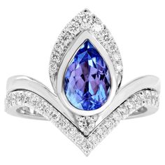 a blue and white ring with diamonds around it