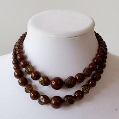 "Two strands of round chocolate brown beads clasp at back with a U-hook. Graduated in size to largest at front and interspersed with irregularly shaped semi-opaque golden sparkle beads. Excellent vintage condition. Beads have a nice shine and a free of scratches.  Gold metal fittings are slightly tarnished. All parts are firmly attached. Length at neck can be adjusted between 14.5\" and 17\" No identifying marks or labels" Dark Brown Jewelry, Elegant Luxury Brown Beads, Golden Sparkle, Brown Jewelry, Double Strand Necklace, Brown Necklace, Retro Jewelry, Double Ring, Strand Necklace