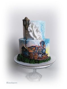 a train themed cake with whipped cream on top