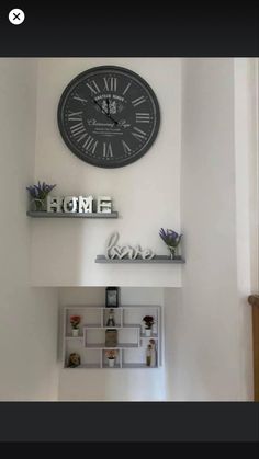 there is a clock on the wall above some shelves