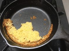 a frying pan with some food inside of it on the stove top, ready to be cooked