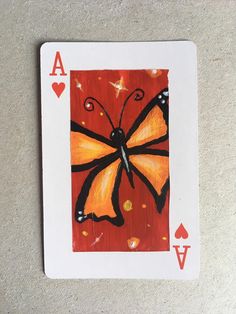 a card with a butterfly painted on it