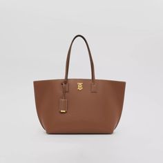 Monogram Motif Leather Medium Tote in Tan - Women | Burberry® Official Everyday Luxury Large Capacity Tote Bag, Brown Tote Bag For Everyday Luxury, Luxury Tote Bags, Streetwear Accessories, Tan Woman, Designer Tote Bags, Medium Tote, Leather Wraps, Hermes Birkin