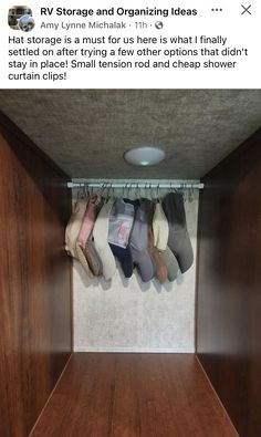 an empty closet with several pairs of shoes hanging from the ceiling and two rows of wooden shelves