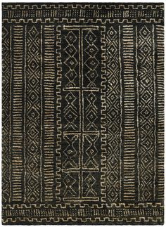 a black and white rug with an intricate design on the bottom, in front of a white background