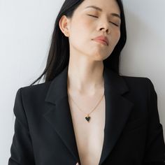 Modern minimalism in a refined choker design. Small polished discs connect to create a delicate chain that sits elegantly against the neck. Specifications: Finish: 18K gold platedCore: Titanium steelGemstone: Black or White Mother of PearlSize: 45 cm chain + 5 cm extenderClosure: Lobster clasp Black Heart-shaped Necklace For Formal Occasions, Black Gold Plated Charm Necklace With Adjustable Chain, Black Heart-shaped Formal Necklace, Formal Black Heart-shaped Necklace, Minimalist Gold Necklace With Black Enamel, Black Enamel Heart Pendant Jewelry Gift, Minimalist Gold Plated Heart Pendant Necklace, Black Clavicle Chain Necklace For Her, Minimalist Black Enamel Pendant Necklace