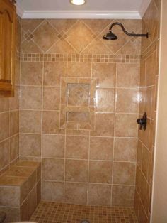 a walk in shower sitting next to a toilet