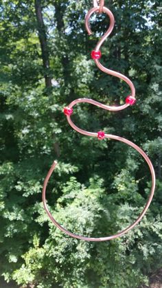 a wind chime in the shape of a snake