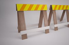 two wooden stools with yellow and white stripes on them