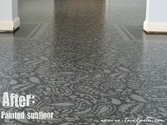 a black and white floor with an ornate pattern on it